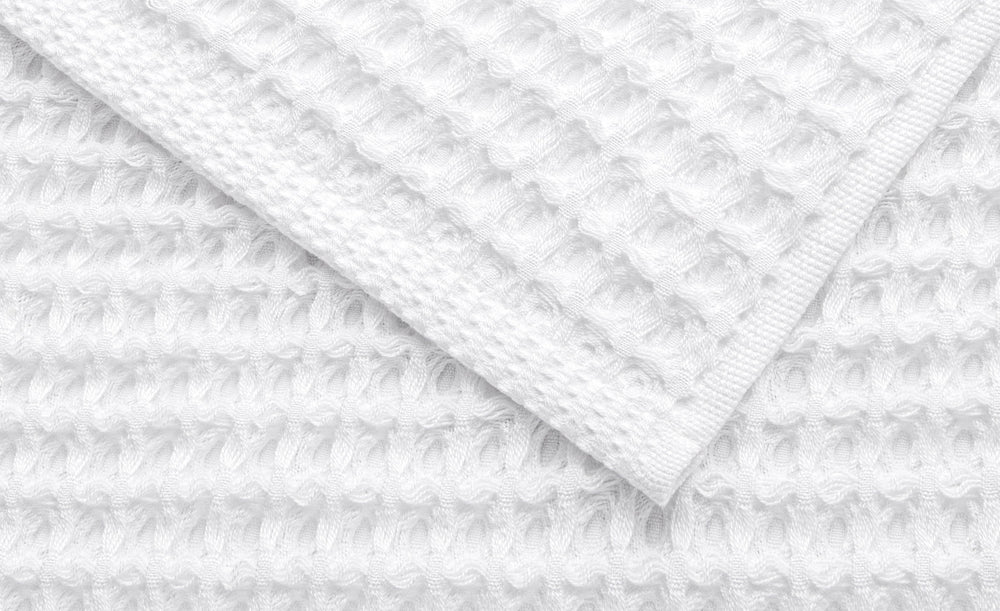 Close-up of the soft honeycomb texture of an Alusa Home Waffle Collection towel